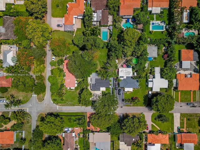 1003 NE 115th St, Biscayne Park, FL 33161 - aerial view of property and surrounding area with a pool and nearby suburban area