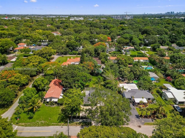 1003 NE 115th St, Biscayne Park, FL 33161 - aerial perspective of suburban area with a tree filled landscape
