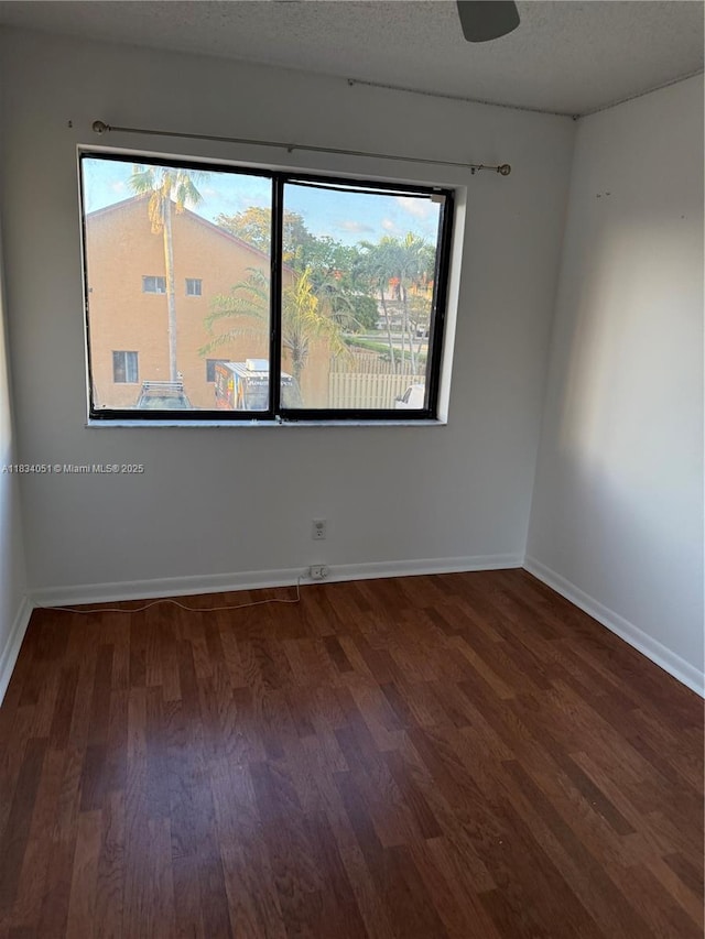2912 NW 80th Ave, Sunrise, FL 33322 - empty room featuring wood finished floors and a textured ceiling