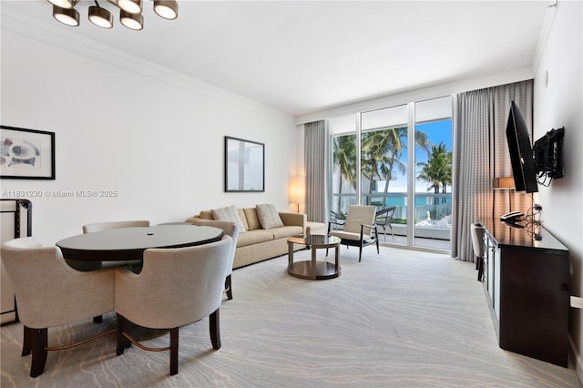 4391 Collins Ave Unit 623, Miami Beach, FL 33140 - living area featuring a wall of windows, crown molding, a chandelier, and carpet