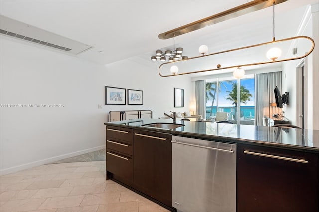 4391 Collins Ave Unit 623, Miami Beach, FL 33140 - kitchen featuring stainless steel dishwasher, dark countertops, dark brown cabinets, hanging light fixtures, and crown molding