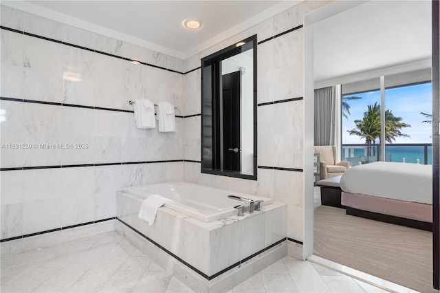 4391 Collins Ave Unit 623, Miami Beach, FL 33140 - ensuite bathroom with a bath and tile walls