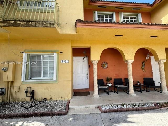 7382 SW 152nd Ave Unit 206, Miami, FL 33193 - property entrance with covered porch and stucco siding
