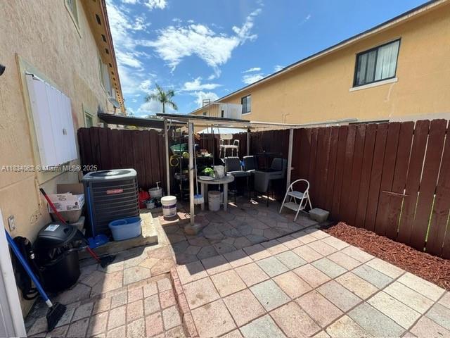 7382 SW 152nd Ave Unit 206, Miami, FL 33193 - fenced backyard featuring a patio area