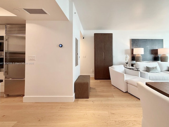 1331 Brickell Bay Dr Unit 506, Miami, FL 33131 - living area featuring light wood-style flooring and electric panel
