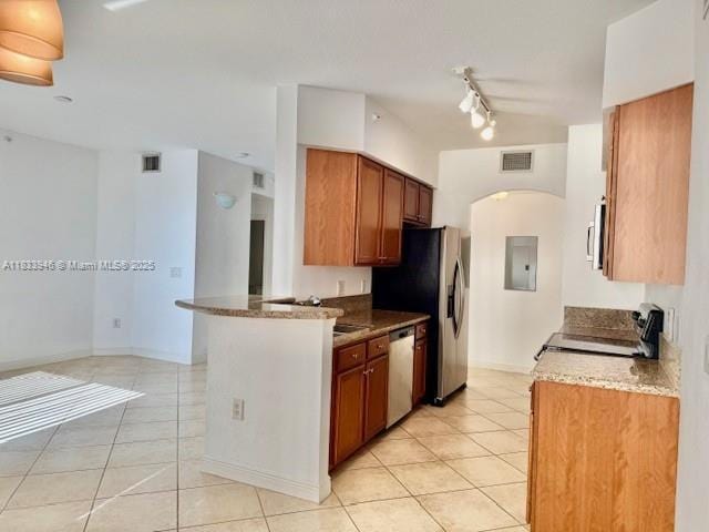 9021 SW 94th St Unit 606, Miami, FL 33176 - kitchen featuring appliances with stainless steel finishes, light tile patterned floors, arched walkways, brown cabinetry, and electric panel