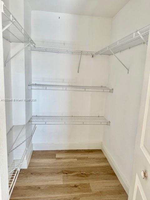 9021 SW 94th St Unit 606, Miami, FL 33176 - spacious closet with wood finished floors