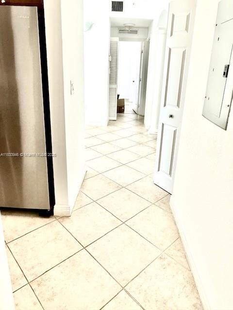 9021 SW 94th St Unit 606, Miami, FL 33176 - hall featuring electric panel and light tile patterned flooring
