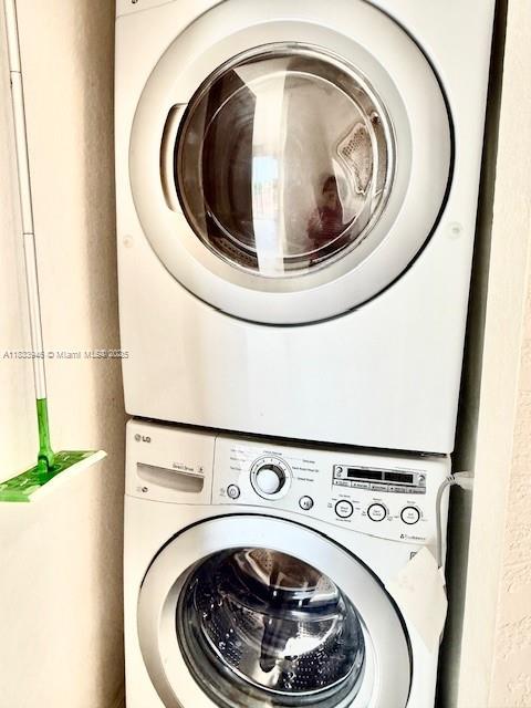9021 SW 94th St Unit 606, Miami, FL 33176 - laundry area featuring stacked washer and clothes dryer