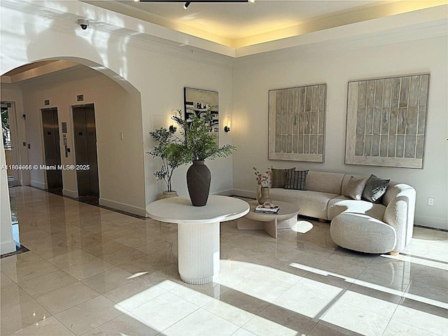 9021 SW 94th St Unit 606, Miami, FL 33176 - living area featuring arched walkways, elevator, and a tray ceiling