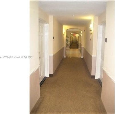 9021 SW 94th St Unit 606, Miami, FL 33176 - hall with arched walkways and carpet flooring