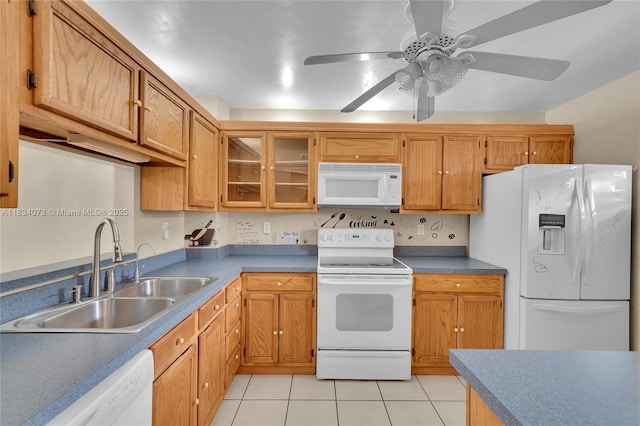 1100 NW 87th Ave Unit 306, Coral Springs, FL 33071 - kitchen featuring white appliances, a ceiling fan, light tile patterned floors, glass insert cabinets, and brown cabinetry