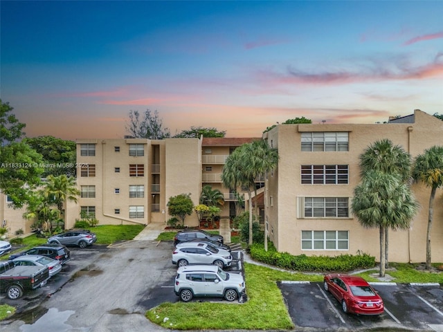 9460 Live Oak Pl Unit 407, Davie, FL 33324 - property at dusk featuring uncovered parking