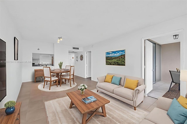 9460 Live Oak Pl Unit 407, Davie, FL 33324 - living area featuring light tile patterned floors
