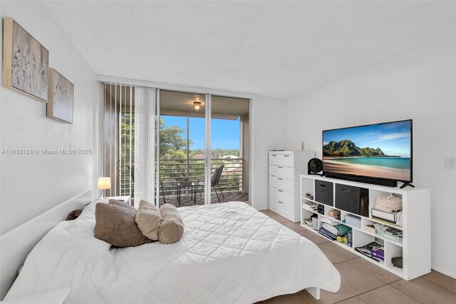 9460 Live Oak Pl Unit 407, Davie, FL 33324 - bedroom with access to exterior and tile patterned floors