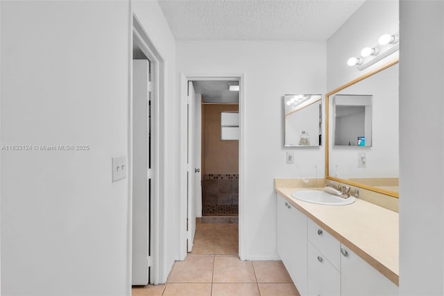9460 Live Oak Pl Unit 407, Davie, FL 33324 - bathroom featuring tile patterned floors, vanity, and a textured ceiling