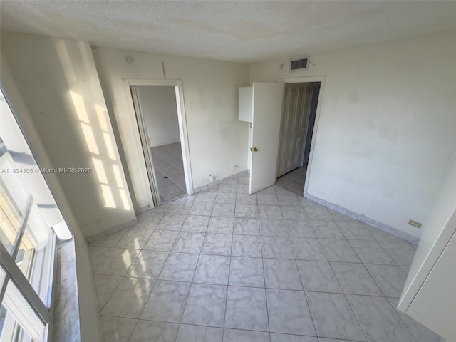 230 174th St Unit 2207, Sunny Isles Beach, FL 33160 - spare room featuring a textured ceiling