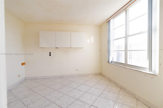 230 174th St Unit 2207, Sunny Isles Beach, FL 33160 - empty room featuring light tile patterned floors and baseboards