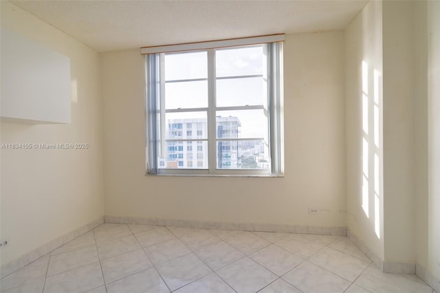 230 174th St Unit 2207, Sunny Isles Beach, FL 33160 - unfurnished room with light tile patterned floors and a textured ceiling