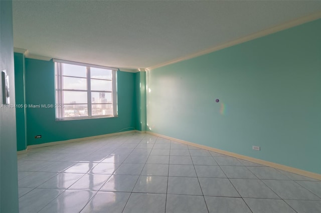 230 174th St Unit 2207, Sunny Isles Beach, FL 33160 - spare room with light tile patterned flooring and baseboards