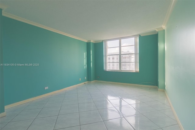 230 174th St Unit 2207, Sunny Isles Beach, FL 33160 - spare room with ornamental molding and light tile patterned floors