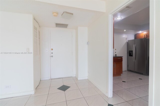 230 174th St Unit 2207, Sunny Isles Beach, FL 33160 - hallway with baseboards and light tile patterned floors