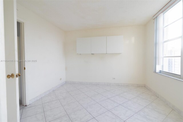 230 174th St Unit 2207, Sunny Isles Beach, FL 33160 - unfurnished room with plenty of natural light