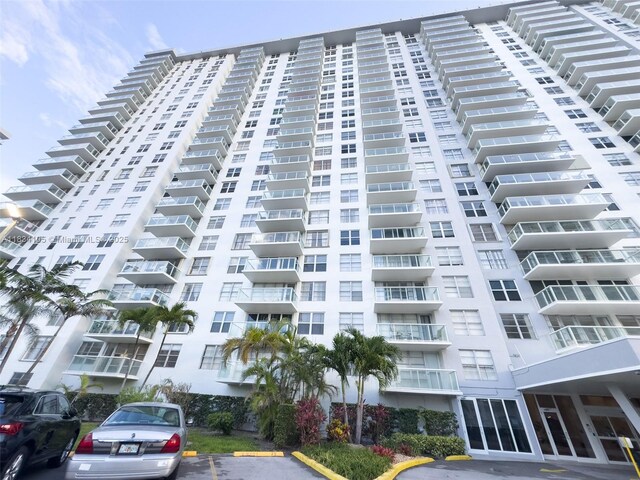 230 174th St Unit 2207, Sunny Isles Beach, FL 33160 - view of apartment building / complex featuring uncovered parking