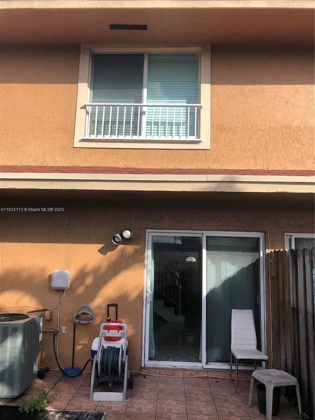 16700 NW 55th Ave Unit 12, Miami Gardens, FL 33055 - back of house featuring stucco siding and a patio