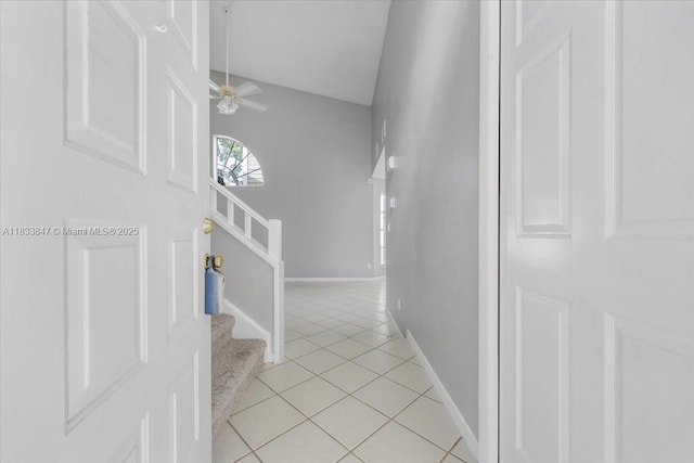 5366 214th Ct S, Boca Raton, FL 33486 - corridor with light tile patterned floors, stairs, and lofted ceiling