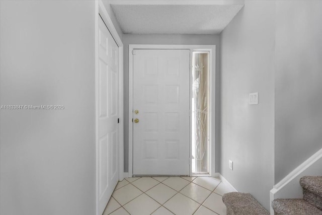 5366 214th Ct S, Boca Raton, FL 33486 - foyer with stairs, light tile patterned flooring, and a textured ceiling