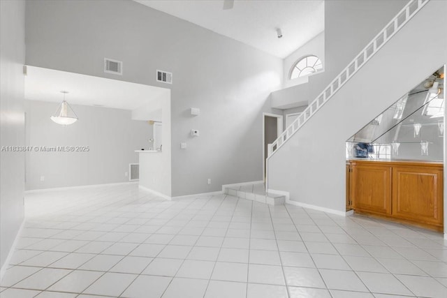 5366 214th Ct S, Boca Raton, FL 33486 - unfurnished living room with high vaulted ceiling and light tile patterned floors