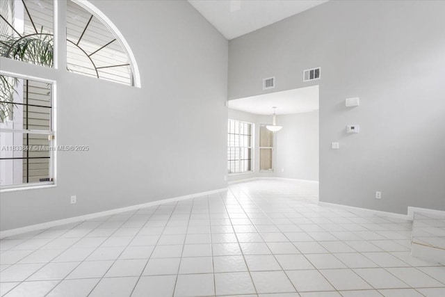 5366 214th Ct S, Boca Raton, FL 33486 - unfurnished room featuring a high ceiling and light tile patterned floors