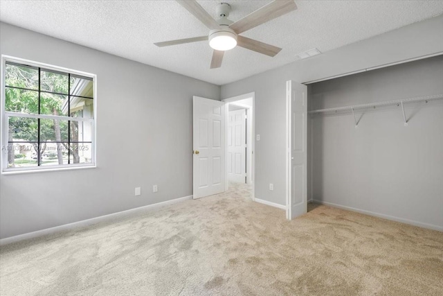 5366 214th Ct S, Boca Raton, FL 33486 - unfurnished bedroom with carpet, a textured ceiling, a closet, and ceiling fan