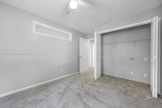 5366 214th Ct S, Boca Raton, FL 33486 - unfurnished bedroom featuring a textured ceiling, carpet, a closet, and a ceiling fan