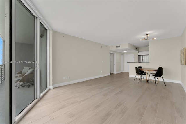 325 S Biscayne Blvd Unit 2816, Miami, FL 33131 - living area featuring light wood finished floors and a chandelier