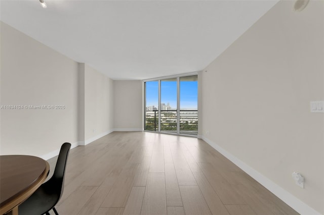 325 S Biscayne Blvd Unit 2816, Miami, FL 33131 - spare room featuring expansive windows and wood finished floors