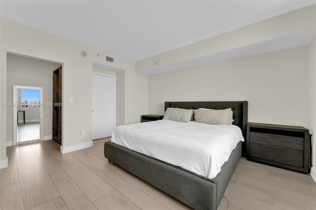 325 S Biscayne Blvd Unit 2816, Miami, FL 33131 - bedroom with light wood-style floors and baseboards