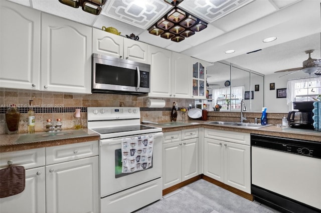 14355 SW 158th St, Miami, FL 33177 - kitchen featuring white appliances, glass insert cabinets, white cabinets, tasteful backsplash, and recessed lighting