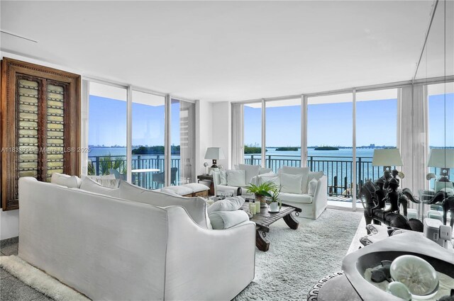 770 NE 69th St Unit 4I, Miami, FL 33138 - living room with a wall of windows and a water view