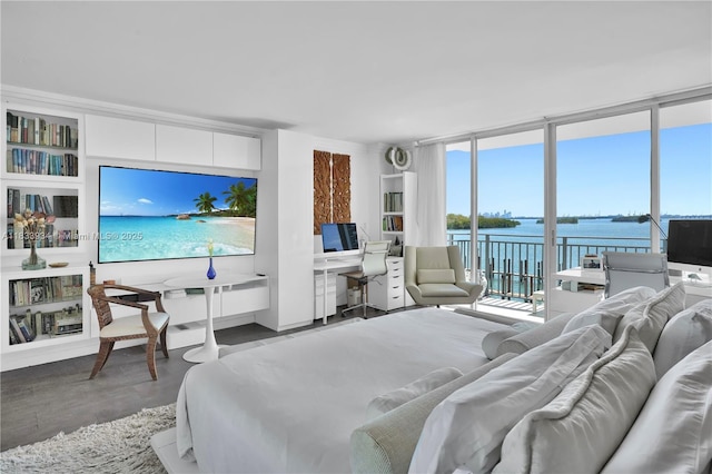 770 NE 69th St Unit 4I, Miami, FL 33138 - bedroom with access to exterior, floor to ceiling windows, a desk, and wood finished floors