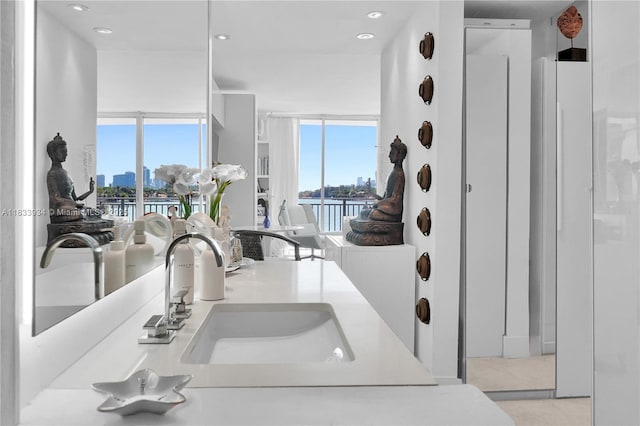 770 NE 69th St Unit 4I, Miami, FL 33138 - kitchen featuring a water view, recessed lighting, a city view, and light countertops