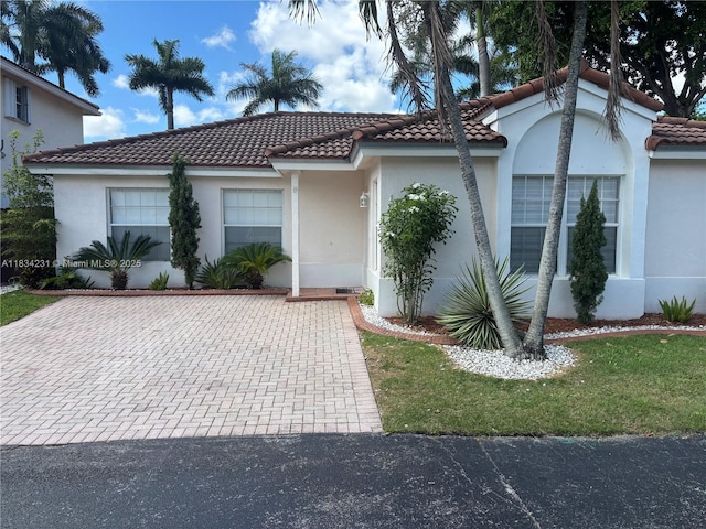 10234 NW 57th St, Doral, FL 33178 - view of front of property featuring a tile roof and stucco siding