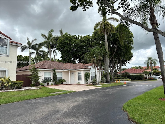 10234 NW 57th St, Doral, FL 33178 - view of front facade with stucco siding and a tile roof
