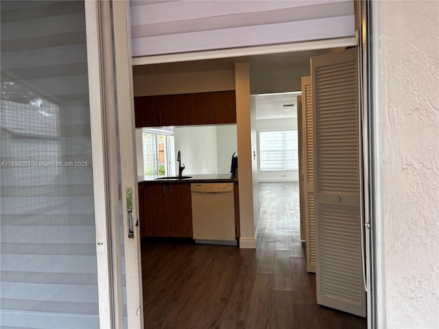 10234 NW 57th St, Doral, FL 33178 - corridor with a sink and dark wood finished floors