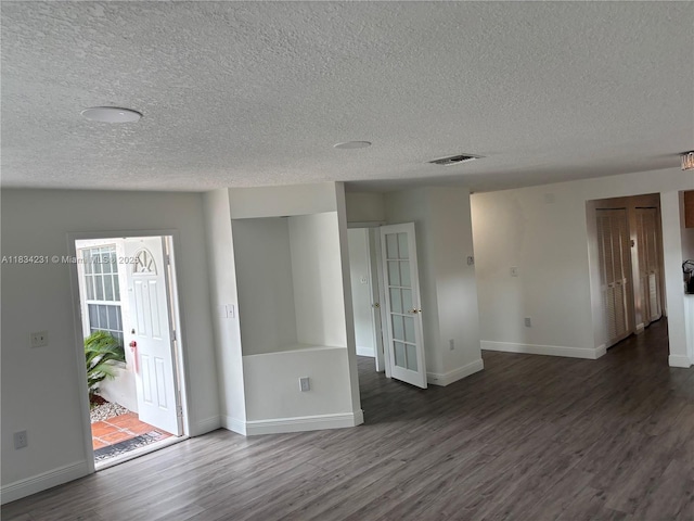 10234 NW 57th St, Doral, FL 33178 - empty room featuring a textured ceiling and wood finished floors