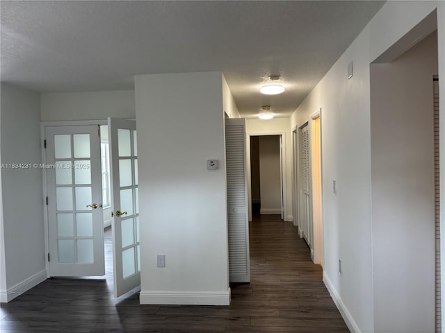 10234 NW 57th St, Doral, FL 33178 - corridor featuring french doors and dark wood-style floors