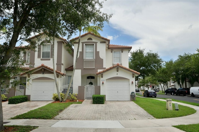 6293 SW 165th Ave, Miami, FL 33193 - mediterranean / spanish house featuring decorative driveway, a tile roof, and stucco siding