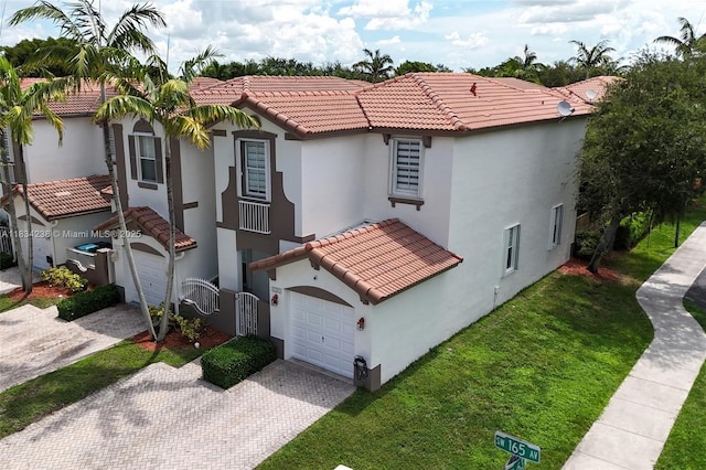 6293 SW 165th Ave, Miami, FL 33193 - mediterranean / spanish-style house featuring decorative driveway, stucco siding, a tiled roof, a garage, and a front lawn