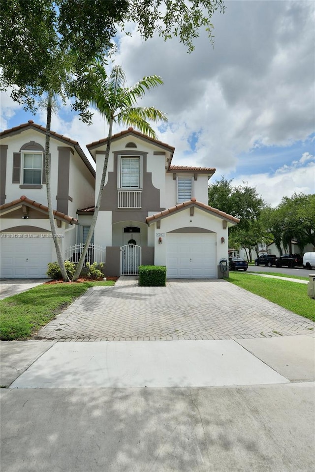 6293 SW 165th Ave, Miami, FL 33193 - view of front of house featuring decorative driveway, stucco siding, a tile roof, and a gate